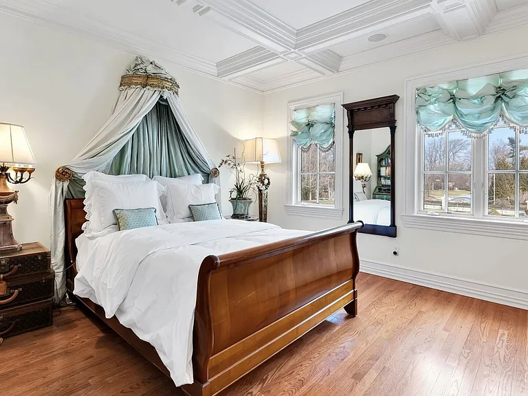 maximalist NJ mansion, 12 The Esplanade in Alpine New Jersey interior master bedroom with massive tray ceilings and canopy bed