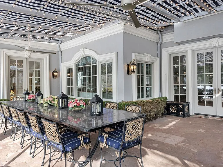 maximalist NJ mansion, 12 The Esplanade in Alpine New Jersey exterior patio with gas fireplace and outdoor kitchen