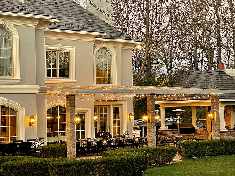 maximalist NJ mansion, 12 The Esplanade in Alpine New Jersey exterior patio with string lights