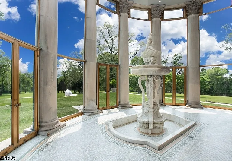 19th-Century Castle in New Jersey, exterior of a massive stone castle in Bernardsville NJ a gorgeous stone columns encased in glass as an atrium