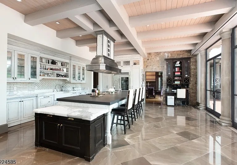 19th-Century Castle in New Jersey, exterior of a massive stone castle in Bernardsville NJ with a modern stainless steel and white kitchen