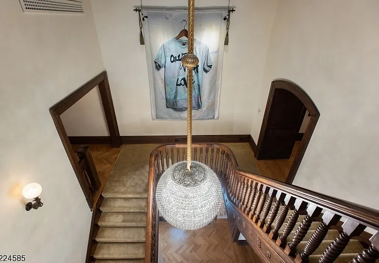 19th-Century Castle in New Jersey, exterior of a massive stone castle in Bernardsville NJ with an enormous wood staircase from King George's design era