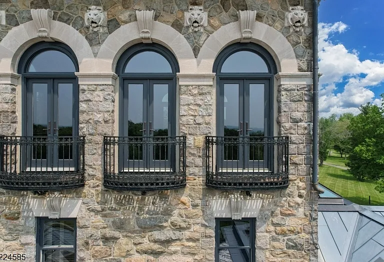 19th-Century Castle in New Jersey, exterior of a massive stone castle in Bernardsville NJ with gargoyles built into the stone