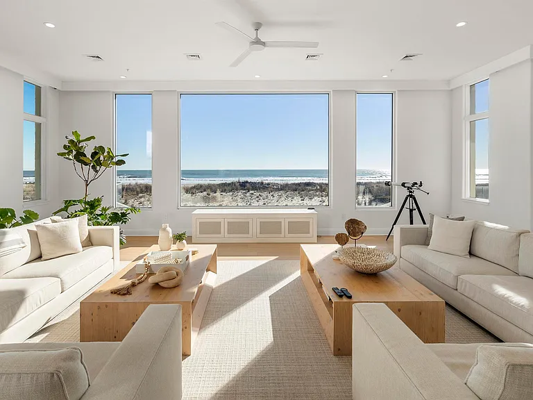 Jersey Shore Beachfront Mansion, beachy modern interior with white sofas and direct views of the atlantic ocean