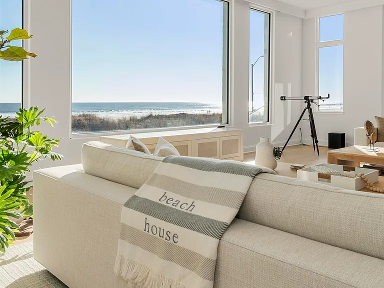 Jersey Shore Beachfront Mansion, beachy interior with white sofas and direct views of the atlantic ocean