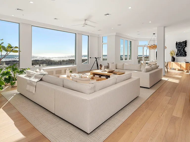 Jersey Shore Beachfront Mansion, beachy modern interior with white sofas and direct views of the atlantic ocean