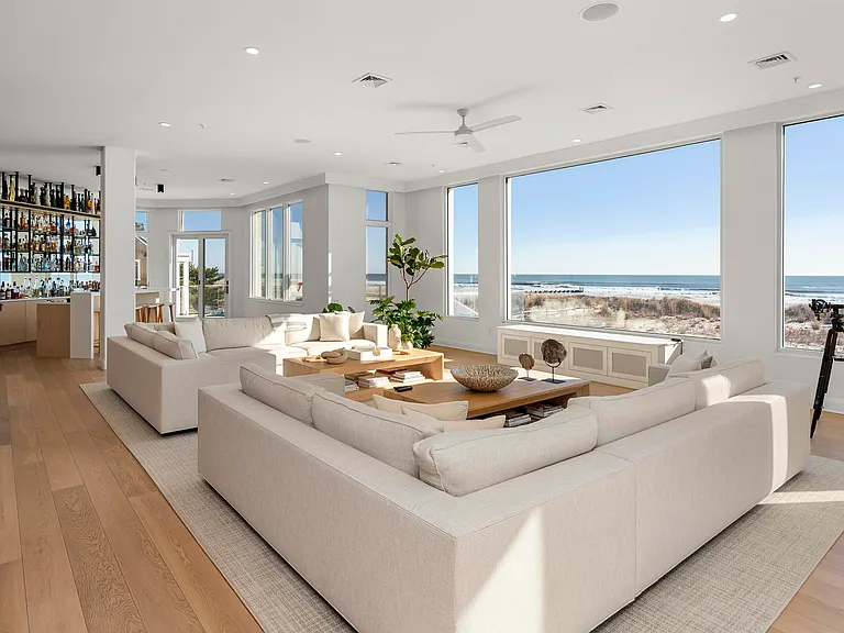 Jersey Shore Beachfront Mansion, beachy modern interior with white sofas and direct views of the atlantic ocean