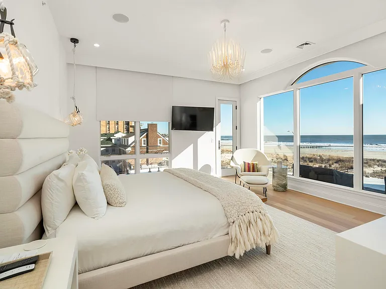 Jersey Shore Beachfront Mansion, beachy modern interior with a master bedroom overlooking the atlantic ocean