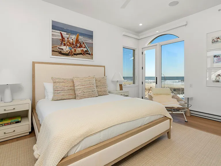 Jersey Shore Beachfront Mansion, beachy modern interior with a guest bedroom overlooking the atlantic ocean