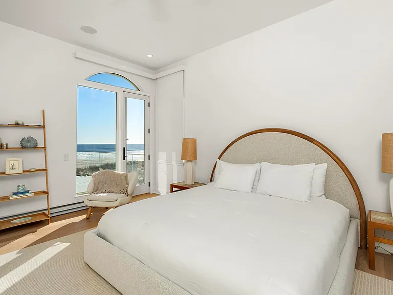 Jersey Shore Beachfront Mansion, beachy modern interior with a guest bedroom overlooking the atlantic ocean