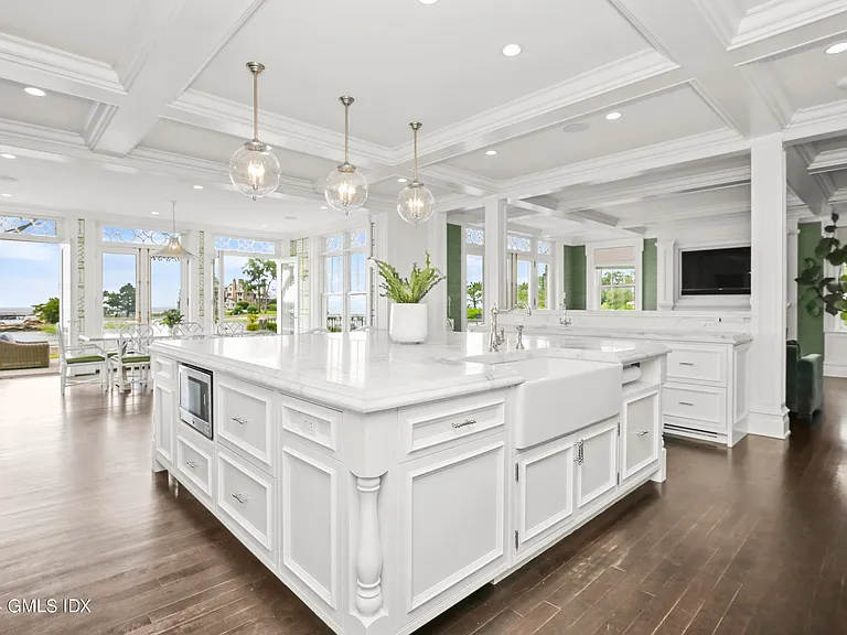 most expensive home in Connecticut, Greenwich mansion interior with modern classic interior all white kitchen overlooking the long island sound