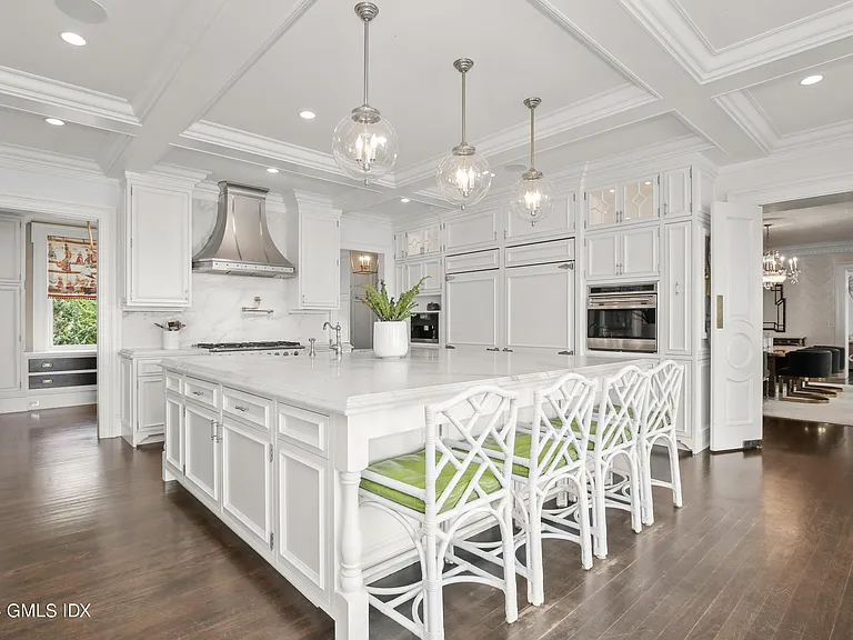 most expensive home in Connecticut, Greenwich mansion interior with modern classic interior all white kitchen overlooking the long island sound