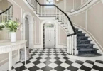 most expensive home in Connecticut, Greenwich mansion interior with modern classic interior with a massive staircase and vaulted ceilings overlooking the long island sound