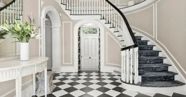 most expensive home in Connecticut, Greenwich mansion interior with modern classic interior with a massive staircase and vaulted ceilings overlooking the long island sound