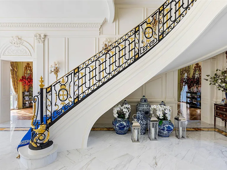 Maximalist Old Brookville Mansion in baroque style, interior of 24 private road in old brookville in nassau county with massive marble curved staircase