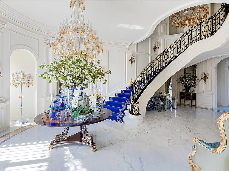 Maximalist Old Brookville Mansion in baroque style, interior of 24 private road in old brookville in nassau county with massive marble curved staircase