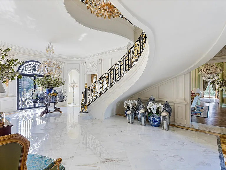 Maximalist Old Brookville Mansion in baroque style, interior of 24 private road in old brookville in nassau county with massive marble curved staircase