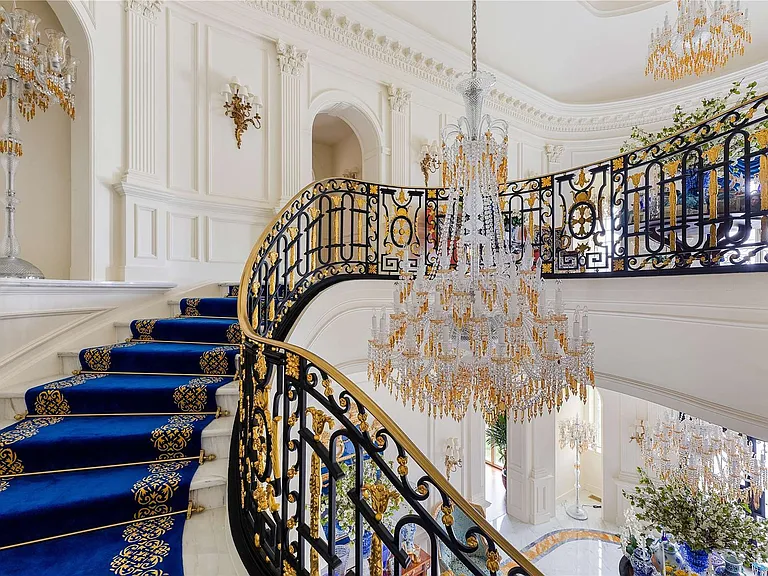 Maximalist Old Brookville Mansion in baroque style, interior of 24 private road in old brookville in nassau county with massive marble curved staircase