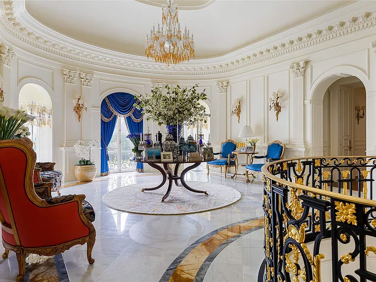 Maximalist Old Brookville Mansion in baroque style, interior of 24 private road in old brookville in nassau county with massive marble curved staircase