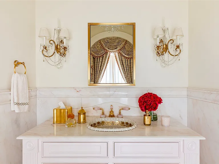 Maximalist Old Brookville Mansion in baroque style, interior of 24 private road in old brookville in nassau county with gorgeous white and gold marble vanities and light fixtures