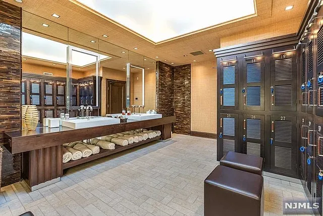 interior of a posh modern saddle river mansion in New Jersey's Bergen County, massive home locker room