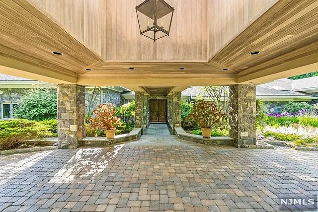 interior of a posh modern saddle river mansion in New Jersey's Bergen County, massive outdoor space and wrap around paver driveway