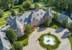 Massive Pennsylvania Castle in Gladwyne, stone exterior featuring a round driveway