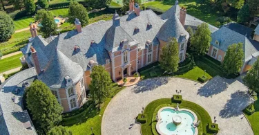 Massive Pennsylvania Castle in Gladwyne, stone exterior featuring a round driveway