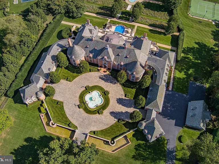 Massive fairytale Pennsylvania Castle in Gladwyne, stone exterior featuring a round driveway