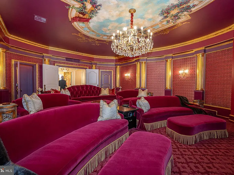 Massive Pennsylvania Castle in Gladwyne, massive red velvet home theater with crystal chandelier and ceiling murals