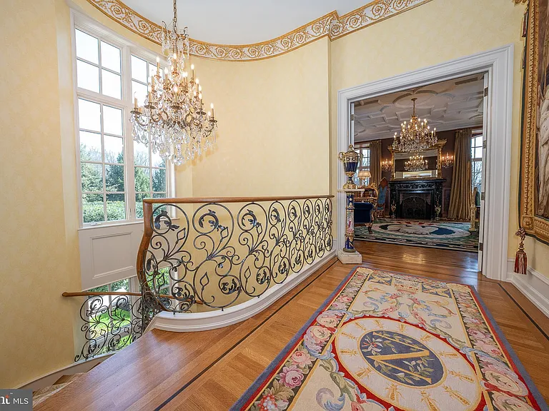 Massive Pennsylvania Castle in Gladwyne, massive hardwood foyer with crystal chandelier and spiral staircase