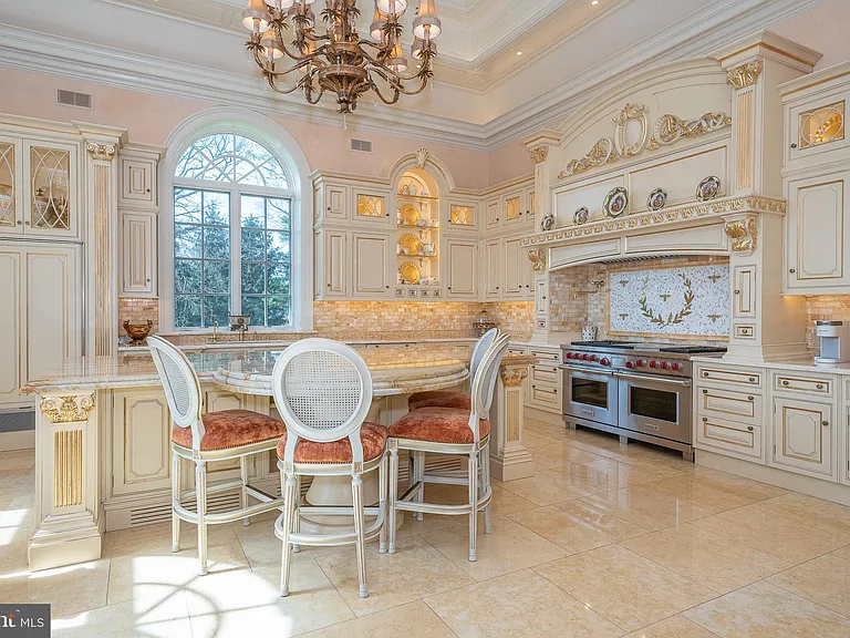 Massive Pennsylvania Castle in Gladwyne, massive cream marble kitchen with tuscan and french countryside details