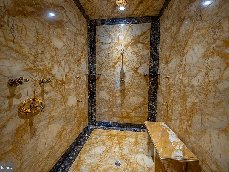 Massive Pennsylvania Castle in Gladwyne, massive master shower with marble tile detailing