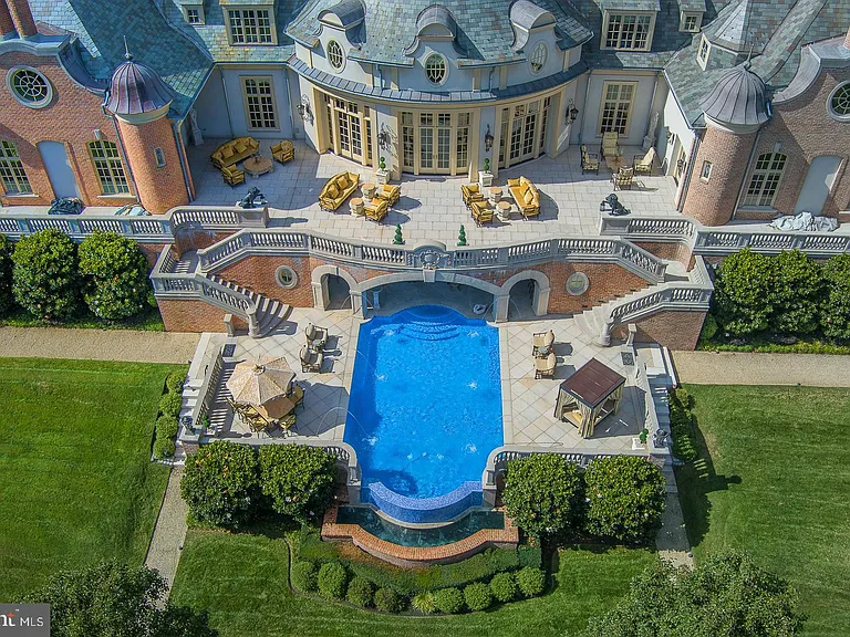 Massive fairytale Pennsylvania Castle in Gladwyne, stone exterior featuring a round driveway