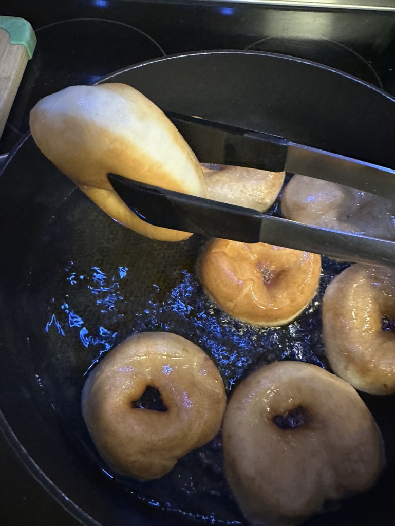 Easy Hanukkah Sufganiyot Donuts Recipe, donuts frying in hot oil