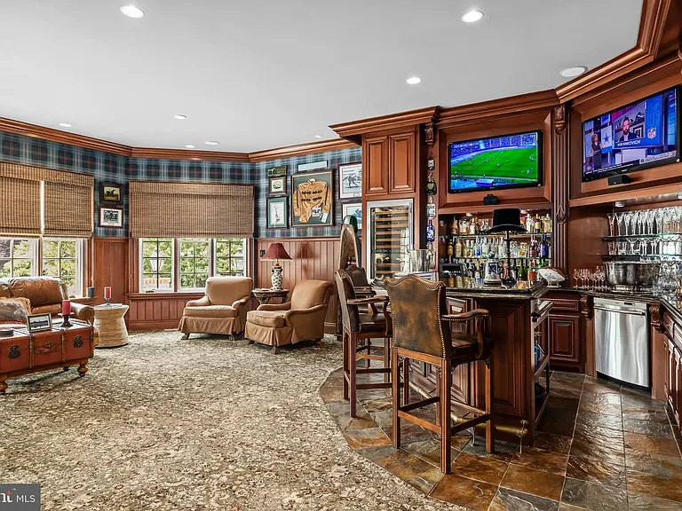 Classic NJ mansion in Moorestown New Jersey, dark wood interior entertainment space with wet bar and tv