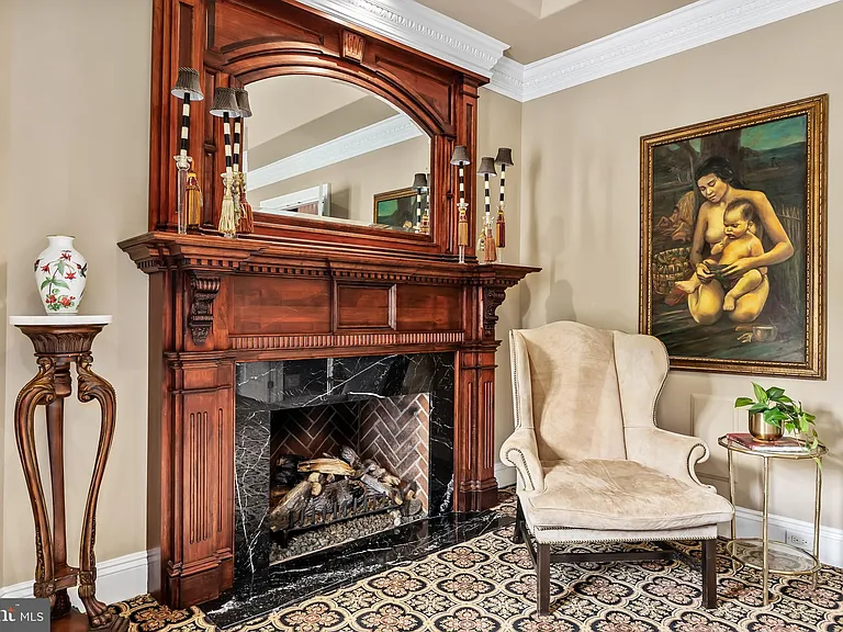 Classic NJ mansion in Moorestown New Jersey, interior with rich dark wood working fireplace and vintage furniture