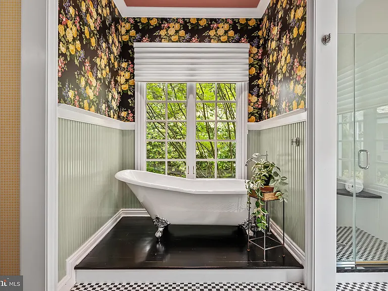 Classic NJ mansion in Moorestown New Jersey, interior bathroom with vintage clawfoot tub and floral wallpaper