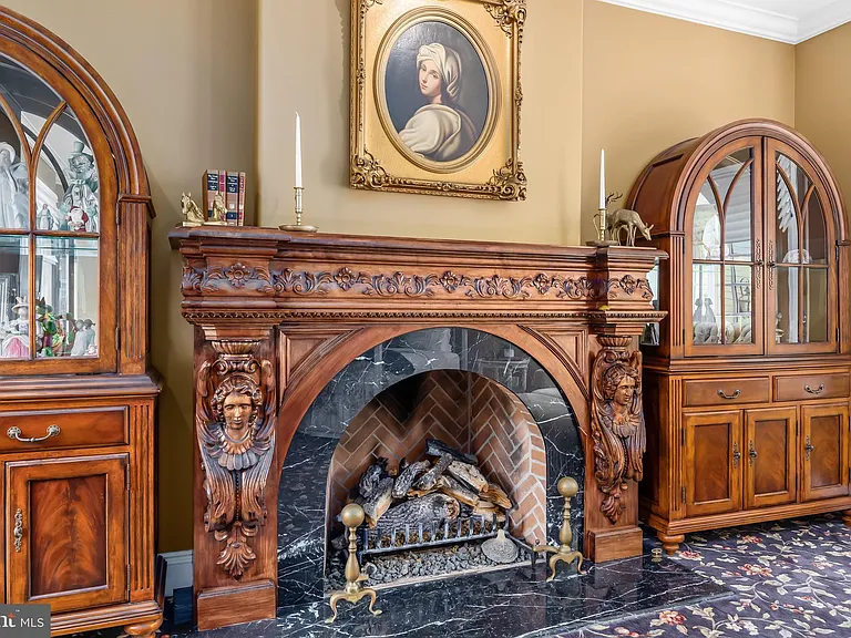 Classic NJ mansion in Moorestown New Jersey, interior with rich dark wood working fireplace and vintage furniture