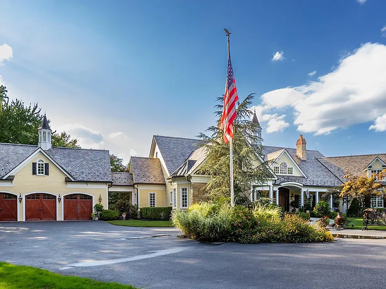 Classic NJ mansion in Moorestown New Jersey, exterior with round driveway and American flag