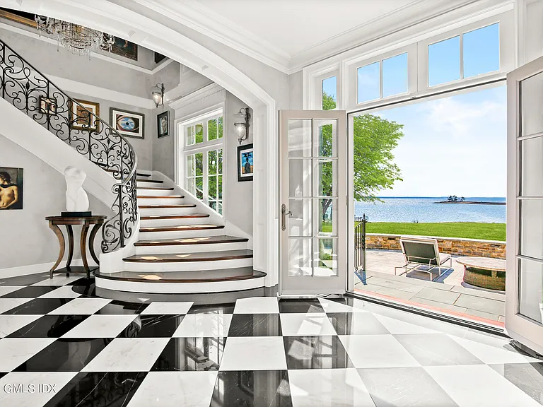 Massive Long Island Sound Mansion, interior of Cedarcliff Road in Riverside Connecticut with a black and white checkerboard foyer