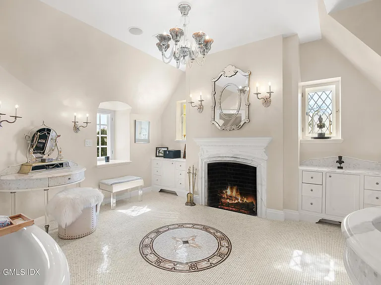 Massive Long Island Sound Mansion, interior of Cedarcliff Road in Riverside Connecticut with an all white living room