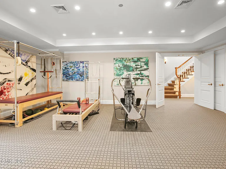 Massive Long Island Sound Mansion, interior of Cedarcliff Road in Riverside Connecticut with home fitness room and pilates equipment