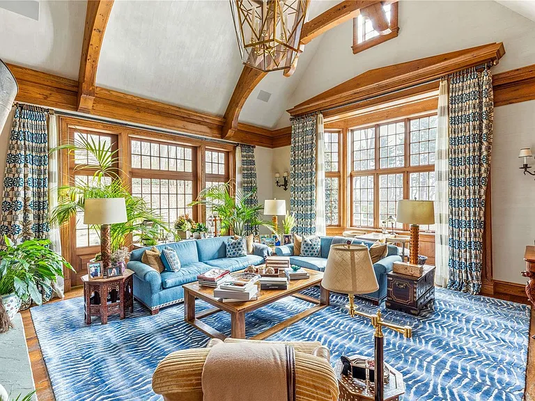 Old Westbury Mansion, exterior of Spring Hill Lane estate with white seating area large seating area with vaulted ceilings