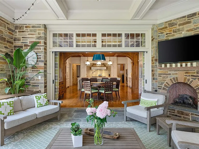 Old Westbury Mansion, exterior of Spring Hill Lane estate with white seating area large seating area stone work