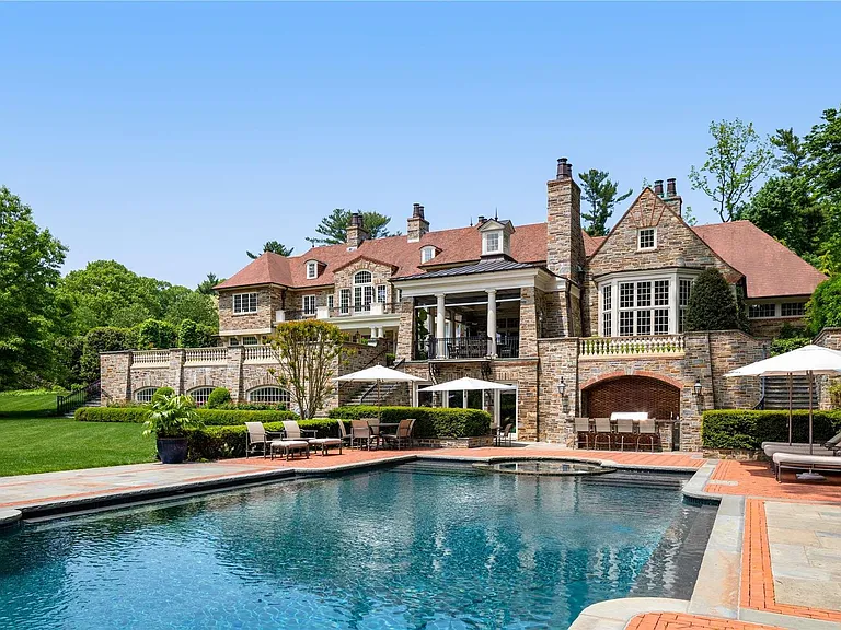 Old Westbury Mansion, exterior of Spring Hill Lane estate with a giant in-ground pool