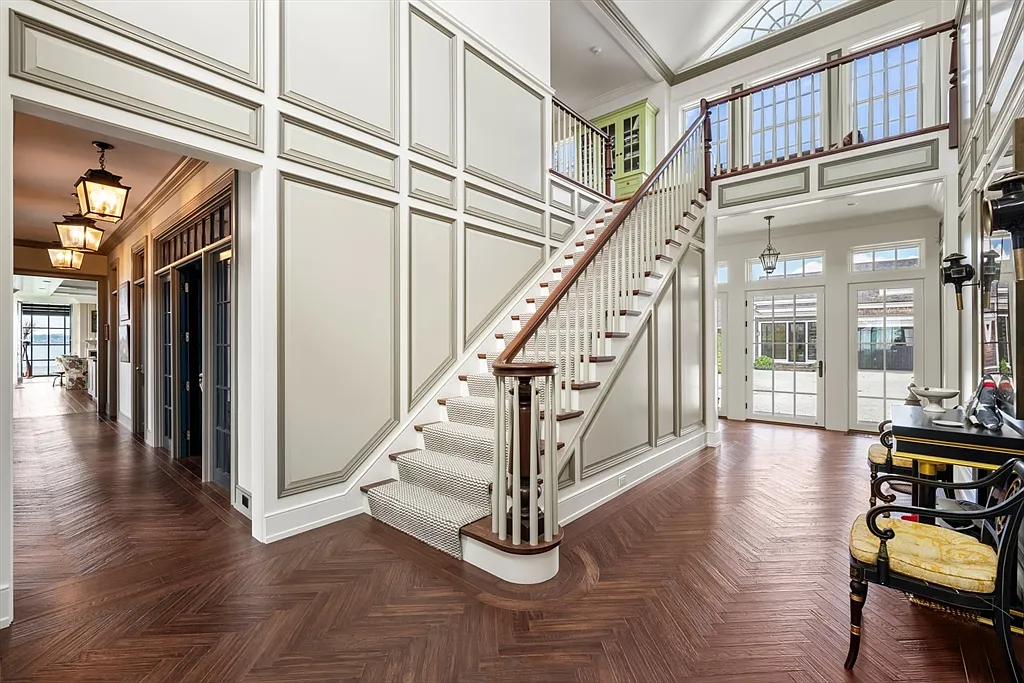 Most expensive house in Rhode Island, interior of 441 West Main Road in Little Compton with sun drenched wooden staircase