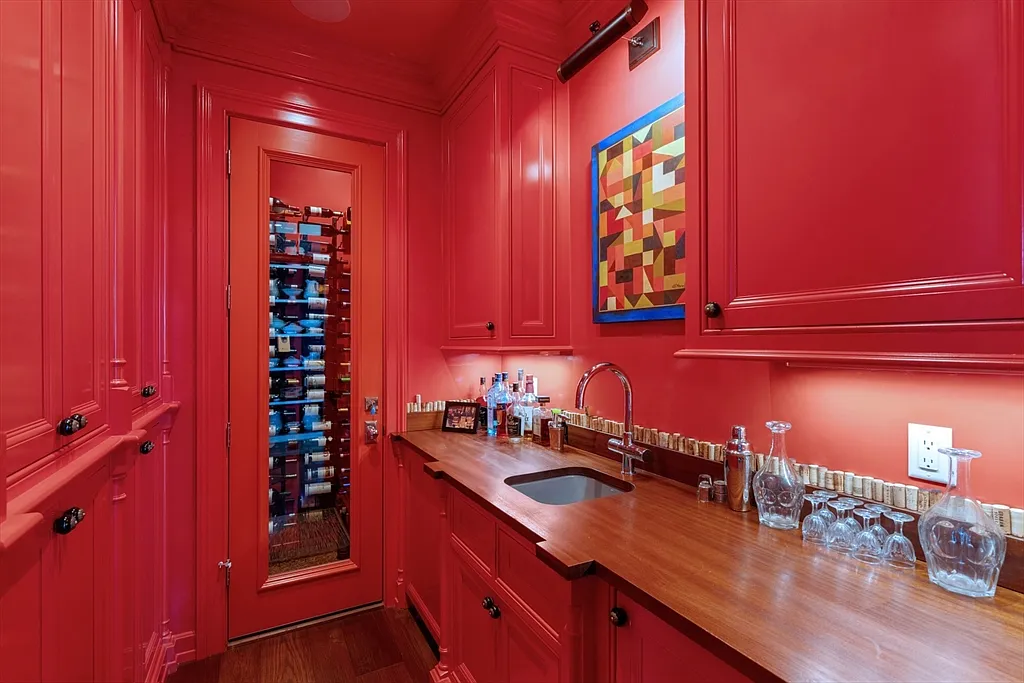 Most expensive house in Rhode Island, interior of 441 West Main Road in Little Compton with bold red wet bar and butlers pantry