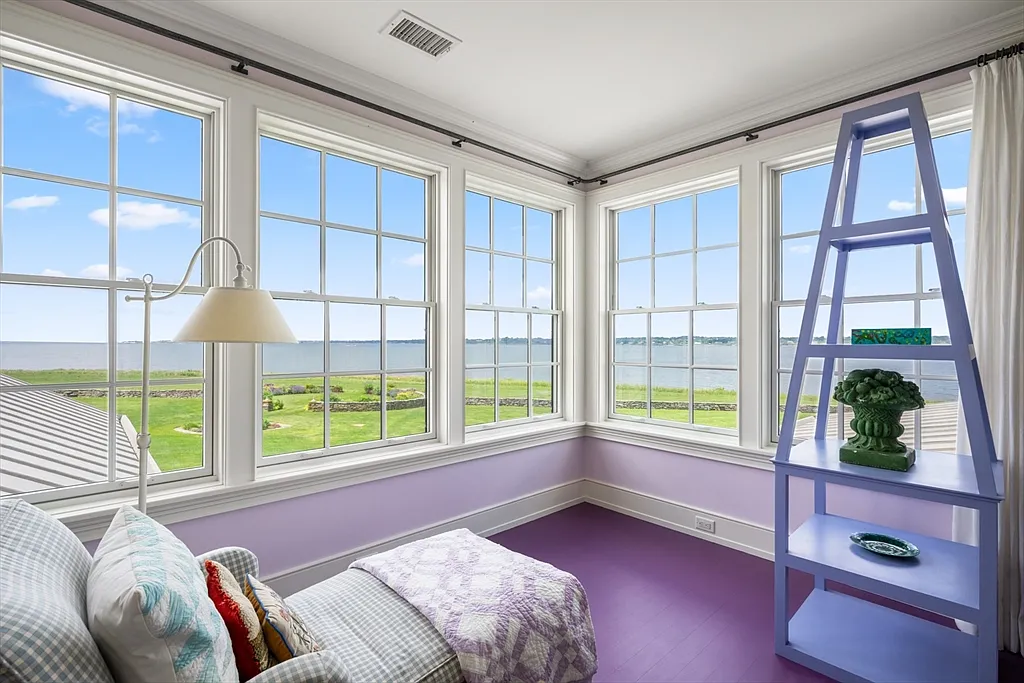 Most expensive house in Rhode Island, interior of 441 West Main Road in Little Compton with sun drenched master bedroom sitting area overlooking the Atlantic Ocean