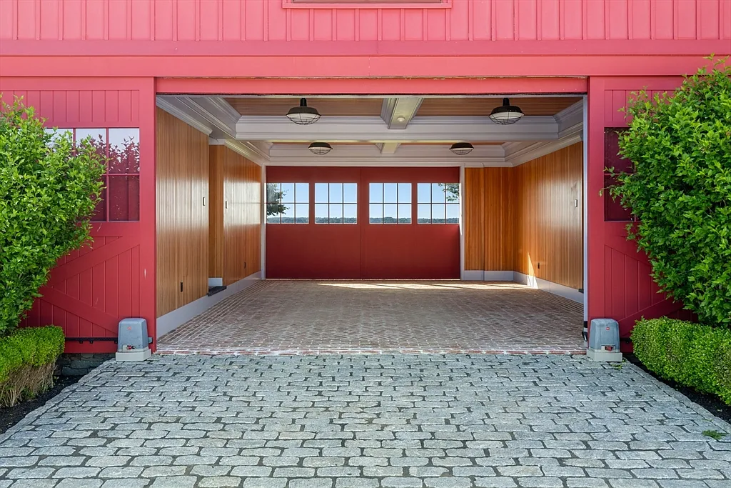 Most expensive house in Rhode Island, interior of 441 West Main Road in Little Compton with sun drenched tiled walkway space connecting buildings